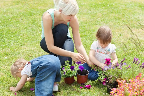 Volunteer gardener explaining planting techniques with clear hand gestures